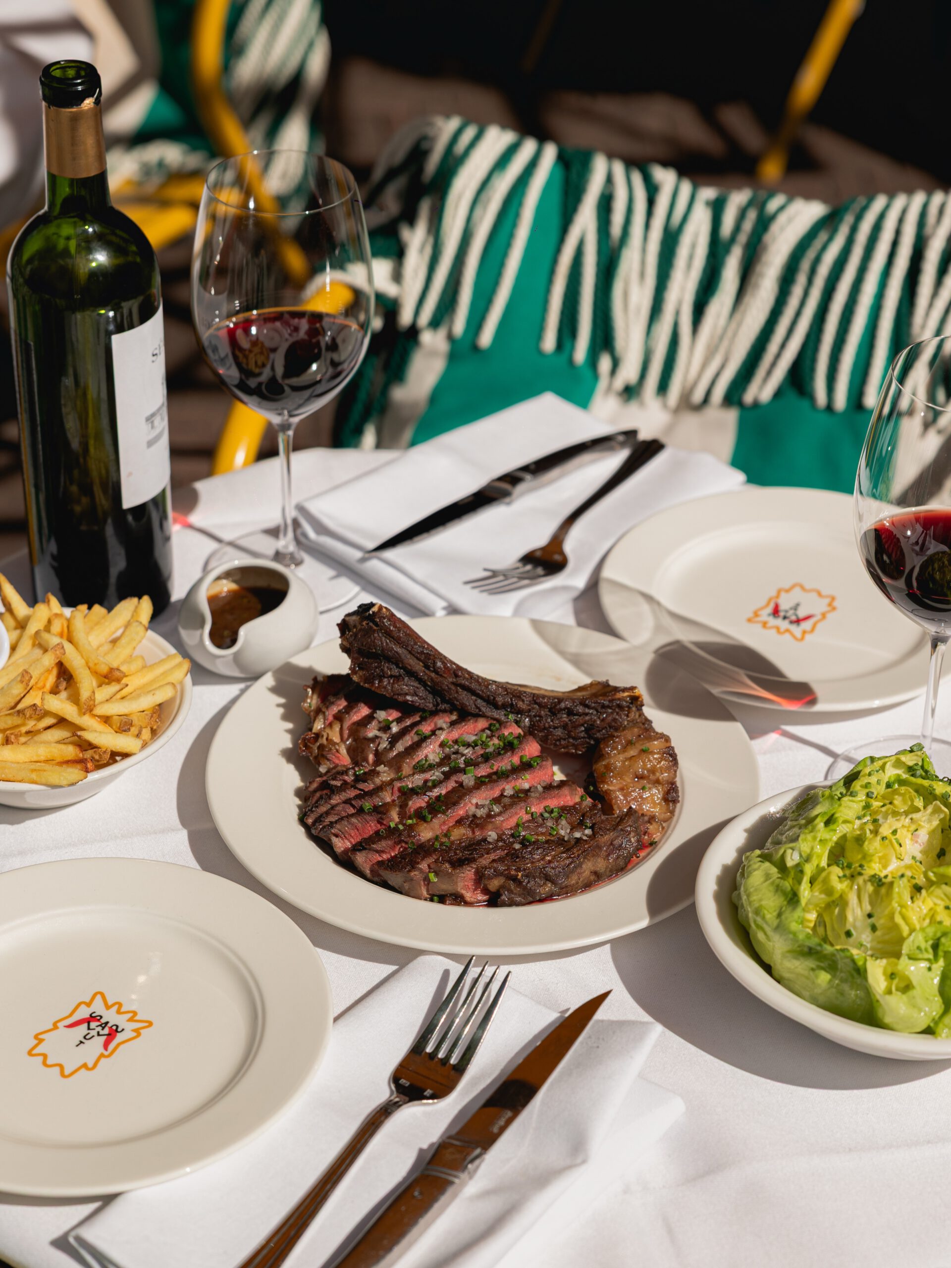 Côte de boeuf to share with fries and red wine on the Salut terrace in De Pijp